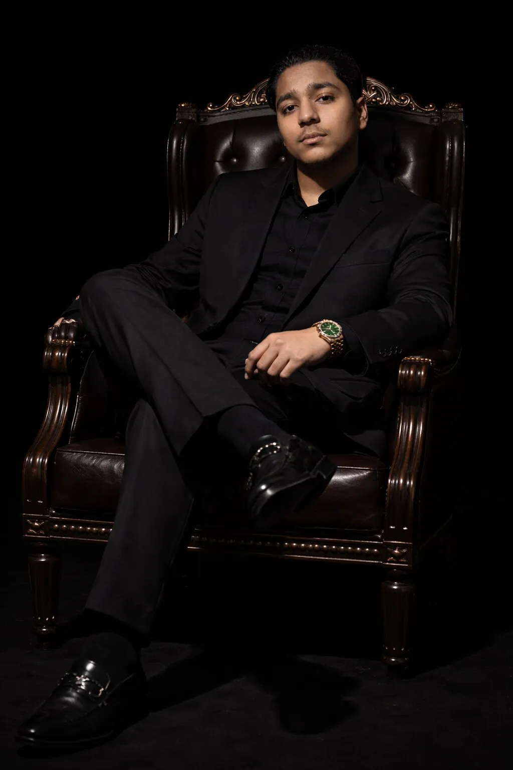 Ammar Haris Munnee, CEO of Antique Accessories, seated in a black suit in Dubai